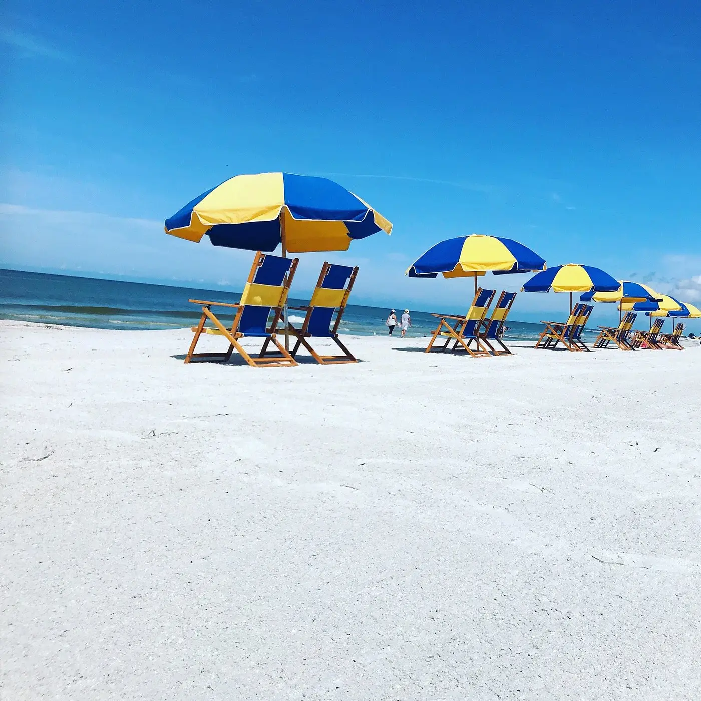Beach umbrellas and chairs on St. Pete Beach, Florida, representing coastal home upkeep and cleaning