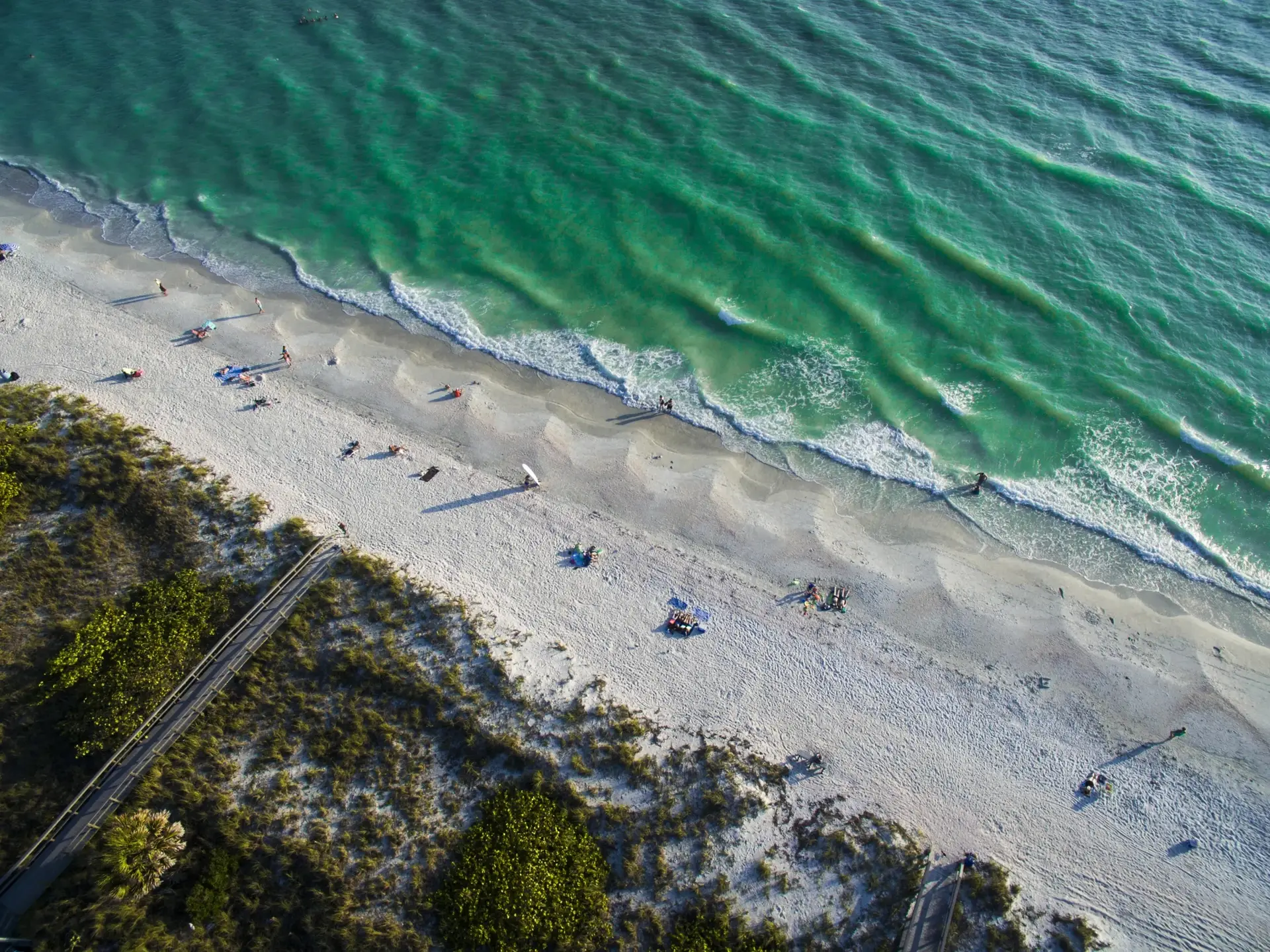 Aerial view of Treasure Island beach and shoreline, reflecting Tampa Bay Home Services' coastal cleaning