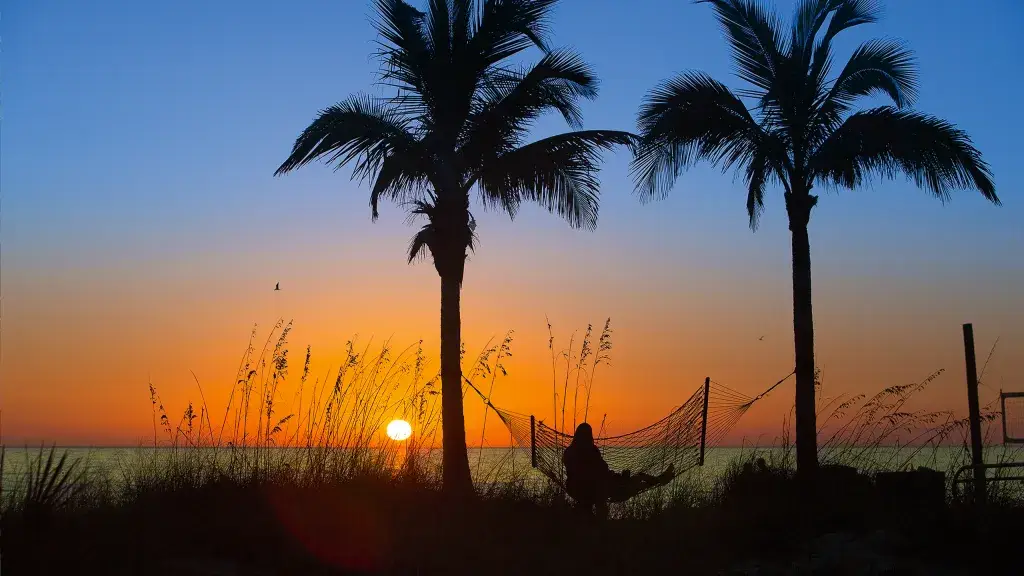Madeira Beach sunset with hammock, representing relaxing coastal living and home upkeep challenges.