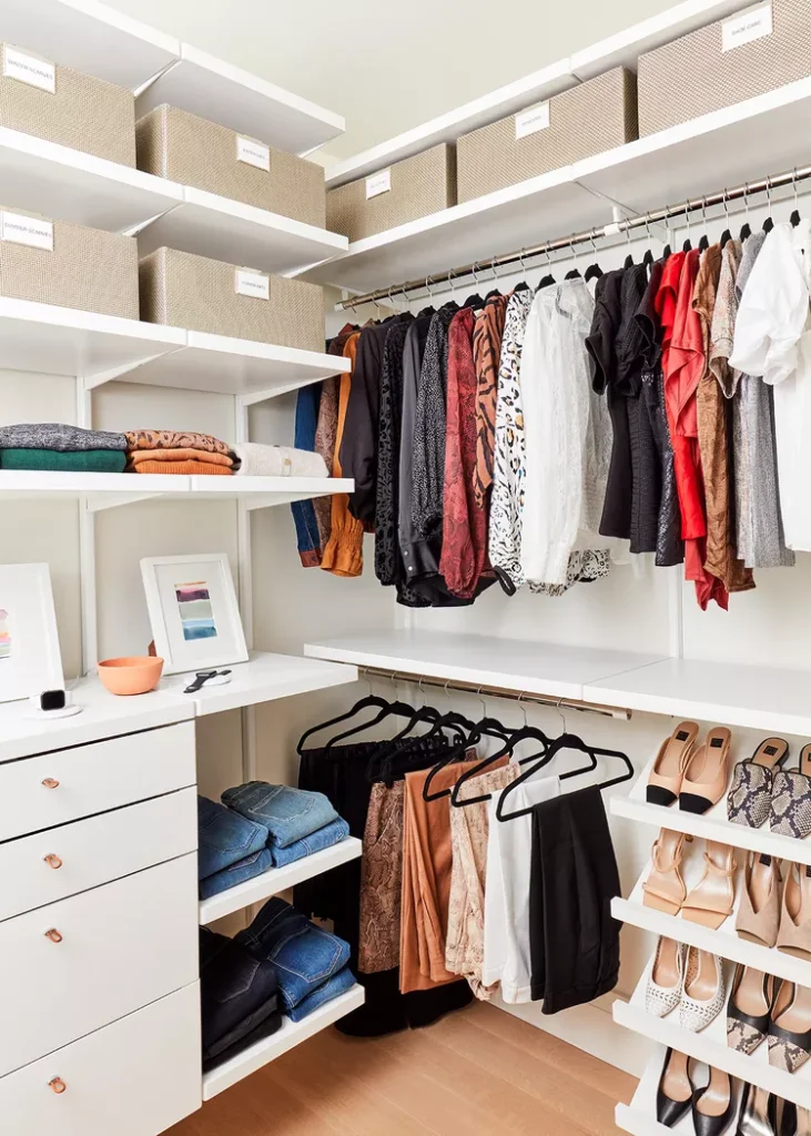 Organized closet with clothing and boxes